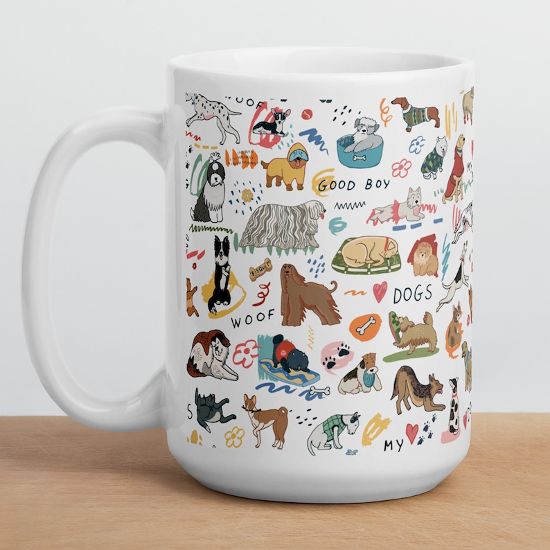 May include: White ceramic mug with a colorful illustration of various dog breeds, including a pug, a golden retriever, a dachshund, and a poodle. The mug features the words "Woof", "Good Boy", "Dogs", and "My".