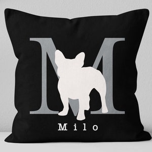 May include: Black pillow with a white silhouette of a French Bulldog and the letter "M" in gray. The name "Milo" is printed in white below the dog.