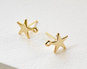 May include: A pair of gold star-shaped earring findings. The findings have a small loop at the top for attaching a charm or bead.