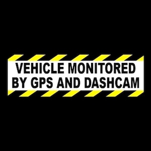 May include: A black and yellow warning sign with the text "VEHICLE MONITORED BY GPS AND DASHCAM".