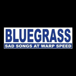 May include: A white rectangular sign with blue text that reads "BLUEGRASS SAD SONGS AT WARP SPEED".