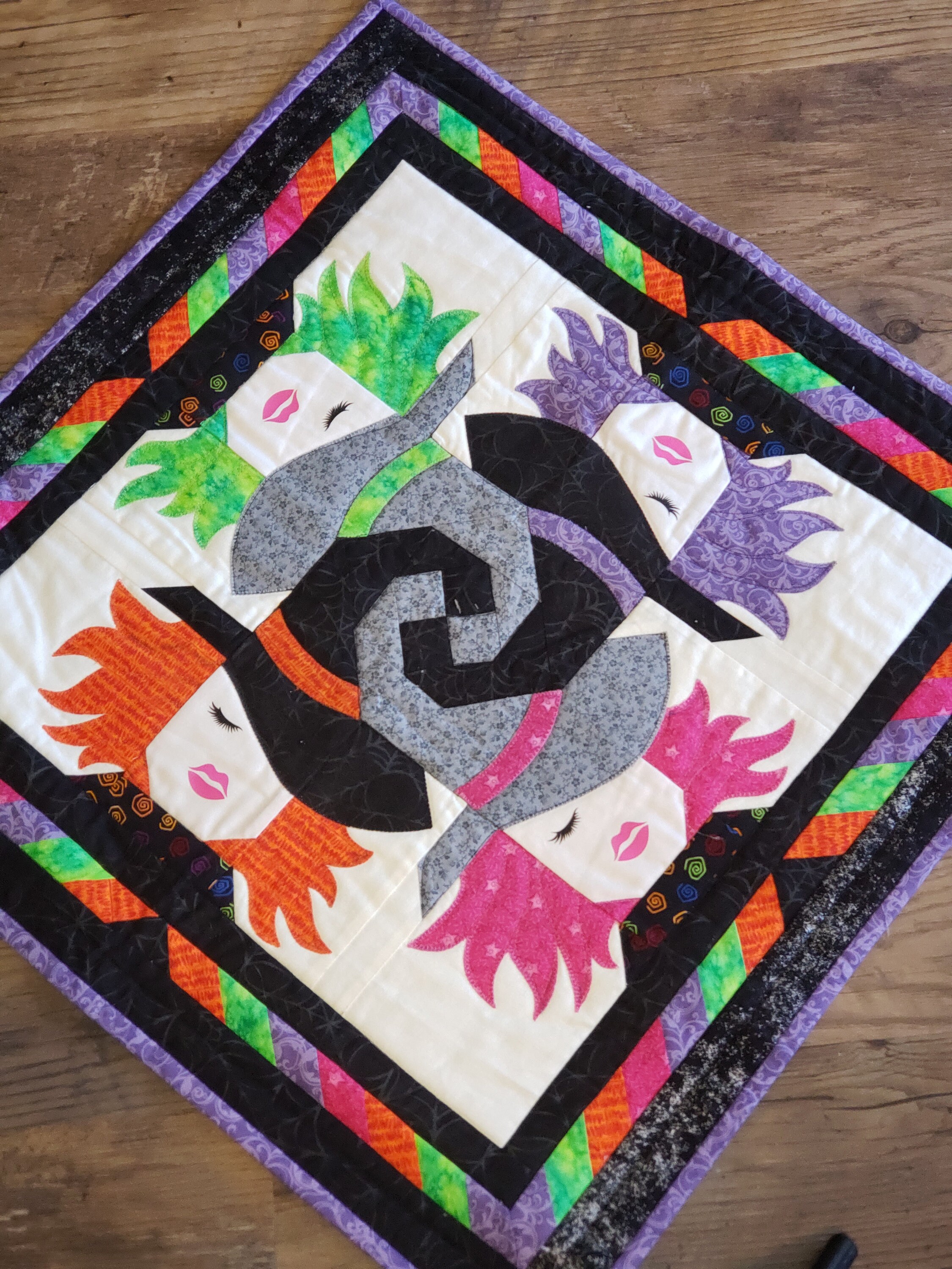 Witchy Whirl Quilted Table Topper NCU0NNT1499