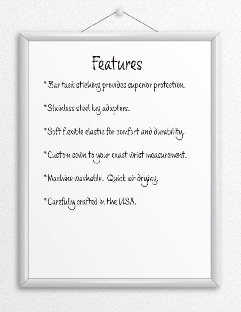 May include: A white dry-erase board with a silver frame hanging on a white wall. The board lists features of a product, including bar tack stitching, stainless steel lug adapters, soft flexible elastic, custom sewing, machine washable, quick air drying, and being crafted in the USA.
