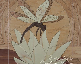 May include: Wooden marquetry art piece featuring a dragonfly perched on a water lily. The dragonfly has brown wings and body, with the water lily in light wood tones. The text "Dawn's Whispers Dragonfly on Water Lily" is visible.