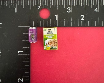 May include: A miniature purple can of loose cannon soda and a miniature box of Quaker Dinosaur Eggs cereal.