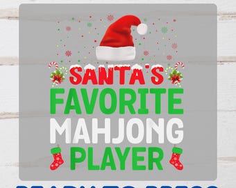 May include: A DTF transfer design with the text "SANTA'S FAVORITE MAHONG PLAYER" in red, green, and white, with a Santa hat and Christmas stockings. The words "READY TO PRESS" are also included.
