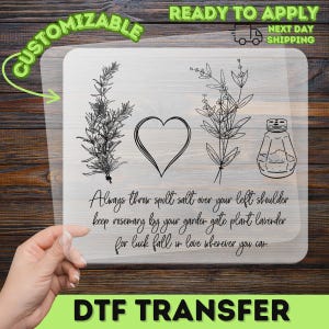 May include: A clear rectangular transfer sheet featuring black line art of a rosemary sprig, a heart, a lavender sprig, and a salt shaker. The text reads: Always throw spilt salt over your left shoulder keep rosemary by your garden gate plant lavender for luck fall in love wherever you can.