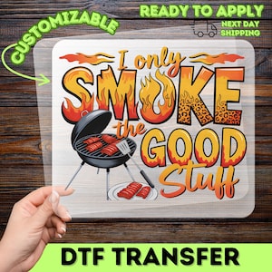 May include: DTF transfer featuring the text "I only smoke the good stuff" in orange and yellow flames. A black barbecue grill with ribs is in the center. The words "Customizable" and "Ready to Apply" are also visible.