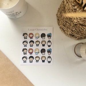 May include: A sheet of stickers featuring 25 illustrated characters from the Lunar Chronicles book series. The characters are depicted in a chibi style with various skin tones, hair colors, and clothing.