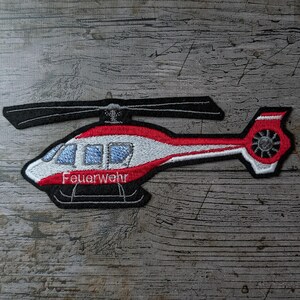 Brandkårens helikopter, lapp, broderi, lapp