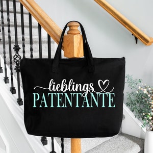 May include: Black tote bag with white text that says "lieblings PATENTANTE" with a heart symbol.