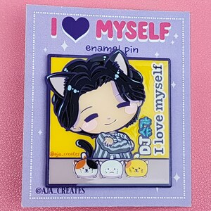 May include: A rectangular enamel pin featuring a cartoon character with black hair and cat ears, wearing a striped shirt. The pin displays the text "DJ SUGA" and "I love myself" against a yellow background, with three small cat figures below.