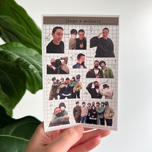 May include: A set of 8 photo stickers featuring a South Korean boy band member in various poses, including a group photo with other members. The stickers are printed on a white background with a grid pattern. The text "jhope x military" is printed at the top of the sheet.