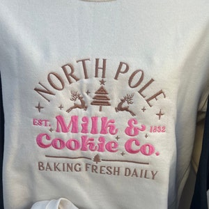 Embroidered North Pole Milk & Cookie Co. Sweatshirt