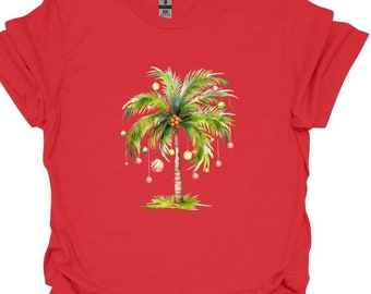 May include: Red t-shirt with a green palm tree decorated with Christmas ornaments.