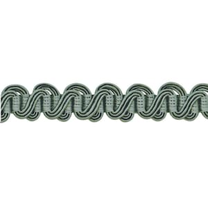 May include: A close-up of a sage green braided trim with a wavy pattern.