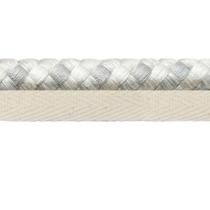 May include: A close-up of a white braided rope with a white cotton tape sewn to the bottom.