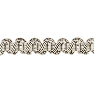 May include: A close-up of a silver braided trim with a wavy pattern.