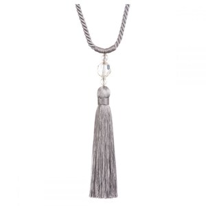 May include: A silver tassel tieback with a clear crystal bead. The tassel is made of a soft, silky material and is perfect for adding a touch of elegance to your home decor.