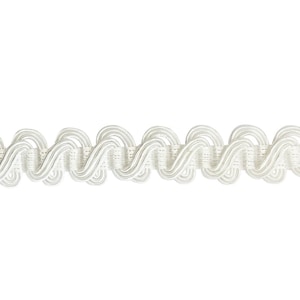 May include: White decorative trim with a wavy, scalloped design. This trim is made of a soft, flexible material and can be used for a variety of crafting projects.