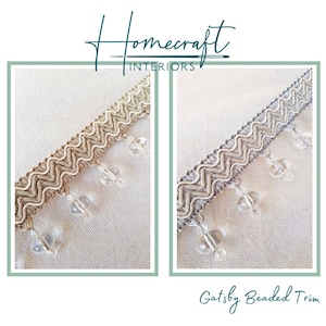 May include: Two samples of beaded trim with a zig-zag pattern. The trim is available in gold and silver. The trim has clear beads hanging from it. The trim is called "Gatsby Beaded Trim".