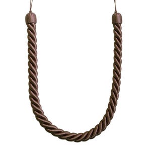 May include: A brown twisted rope curtain tieback with a decorative tassel at each end. The tieback is made of a thick, durable material and is designed to hold curtains open. The rope is approximately 30 inches long.