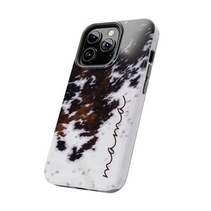 May include: A white, black and brown cowhide phone case with the word "Brown" written in cursive on the side.