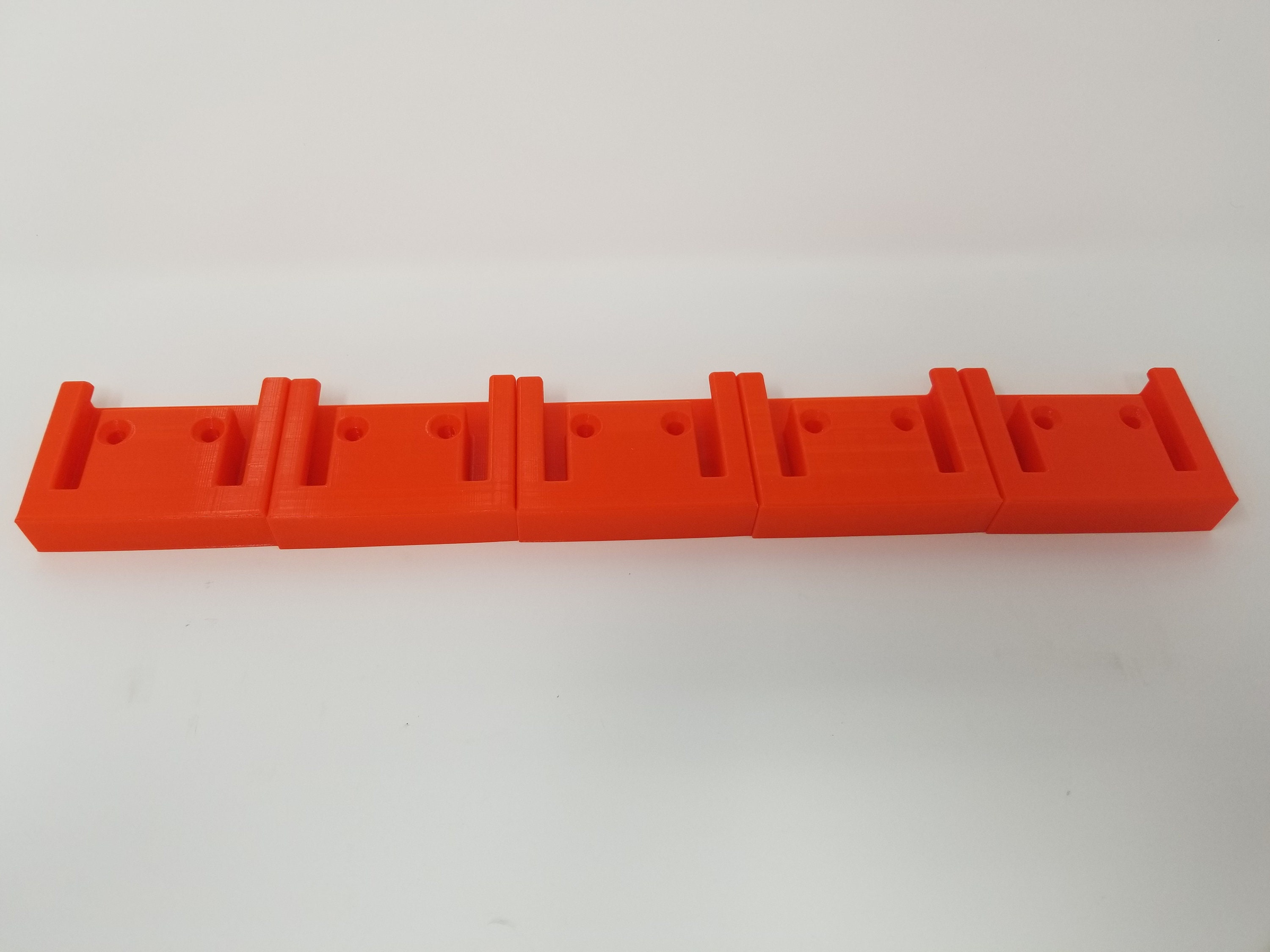 Eight Pack of 3D Printed Battery holders for BAUER 20 volt Tool batteries Free Shipping.