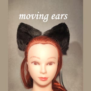 Zwarte beweegbare kattenoren "CuteFurEars" van imitatiebont op een haarband