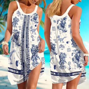 May include: White sleeveless dress with a blue and white cartoon graphic print. The dress features a repeating pattern of characters, dinosaurs, and text that reads "DUNGEON CRAWLER CARL". The dress has a scoop neckline and a side slit.