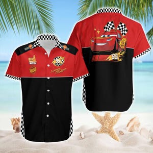 May include: Red and black button-up shirt featuring Lightning McQueen from the Cars movie. The shirt has a checkered collar and cuffs, with the number 95 and the words "Lightning McQueen" printed on it. The back of the shirt shows Lightning McQueen with checkered flags.