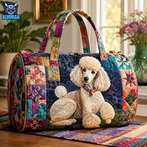 May include: A quilted duffel bag featuring a colorful patchwork pattern of various geometric shapes and floral motifs. The center of the bag displays a detailed applique of a cream-colored poodle dog. The bag has two top handles and a zipper closure.