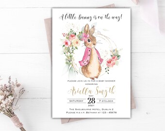 May include: A baby shower invitation with a watercolor illustration of a bunny wearing a pink sweater and a floral wreath. The text reads "A little Bunny is on the way!" and includes the name "Ariella Smyth", the date "May 28, 2021", and the time "7 o'clock".