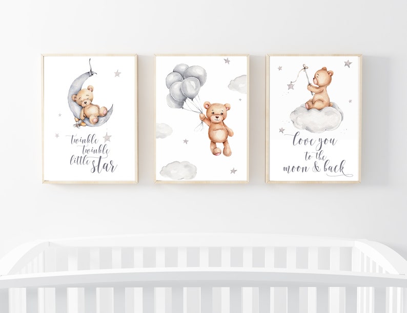 May include: Three watercolor prints featuring a brown teddy bear. The first print shows the bear sleeping on a crescent moon with the text "twinkle twinkle little star". The second print shows the bear holding balloons with stars in the background. The third print shows the bear sitting on a cloud with a star and the text "love you to the moon & back".