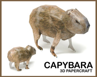 Puede incluir: Un modelo de papel de una capibara, un roedor grande nativo de América del Sur. El modelo es marrón y tiene un aspecto realista. El modelo se muestra junto a una versión más pequeña de sí mismo.