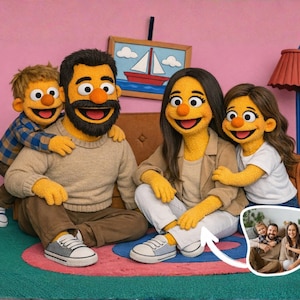 May include: A family portrait featuring puppets resembling a father, mother, and two children. The puppets are dressed in casual attire and seated on a brown sofa. A framed picture of the family is in the lower right corner. The background is a pink wall with a painting of a sailboat.
