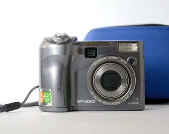 Vintage digital compact point and shoot camera Olympus SP-320 with 7.1 Mega pixels