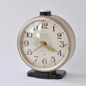 Alarm light brown clock Yantar, Vintage mechanical wind up cute clock from 80s. Mid Century style tabletop clock