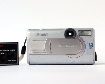 Vintage digital compact camera Canon PowerShot A310 with 3.2 Mega pixels