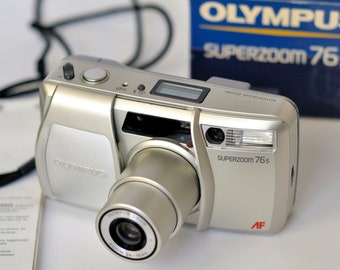 Cámara de película vintage Olympus SuperZoom 76S con zoom de 38-76 mm, cámara compacta de película de 35 mm de apuntar y disparar.