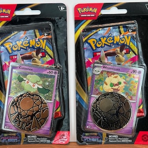 May include: A set of three ceramic mugs with a speckled, matte finish. The mugs are in shades of cream, light gray, and dark gray. Each mug has a simple, minimalist design, perfect for coffee or tea.