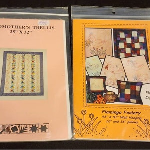 May include: Two quilting pattern packets. The first is for a Grandmother's Trellis quilt, measuring 25 inches by 32 inches. The second is for a Flamingo Foolery quilt, measuring 43 inches by 51 inches, and includes patterns for 12 inch and 16 inch pillows.