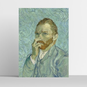 May include: A framed print of Vincent van Gogh's self-portrait. The artwork depicts a man with a red beard and yellow hair, wearing a blue suit. The background features swirling blue and green brushstrokes.