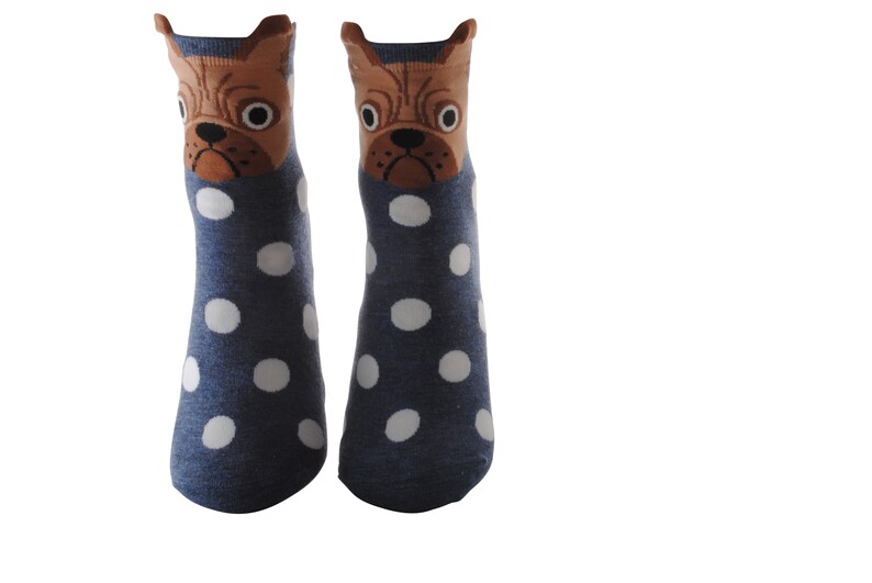 May include: A pair of blue socks with white polka dots and a brown dog face on the top of each sock.