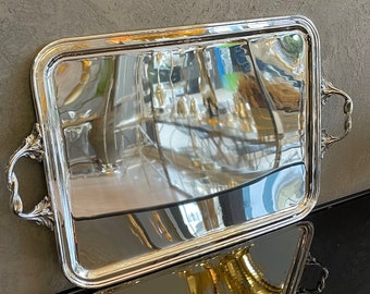 This serving tray is rectangular in Silver color. Manufactured using high quality brass material. Silver plating is used as coating.