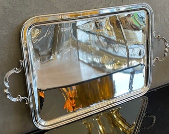 This serving tray is rectangular in Silver color. Manufactured using high quality brass material. Silver plating is used as coating.