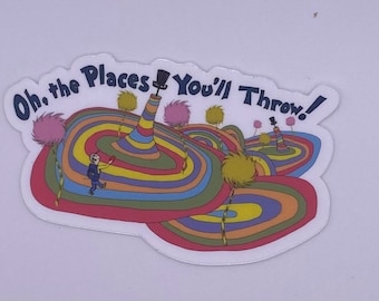 May include: A sticker with the text "Oh, the Places You'll Throw!" and a colourful illustration. The design features a person, rainbow-striped hills, and stylized trees, evoking a children's book aesthetic.