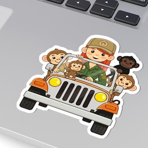 May include: A sticker featuring a cartoon illustration of a safari jeep with a driver and several monkeys. The jeep is orange and white, with yellow headlights. The driver wears a green uniform and a tan hat. The monkeys are brown and black.
