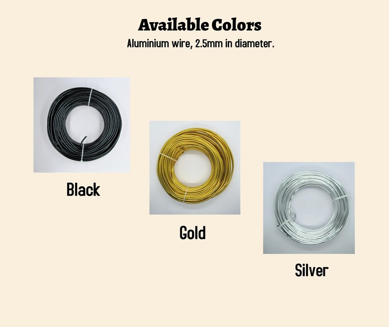 May include: Three spools of aluminium wire, 2.5mm in diameter, in black, gold, and silver.