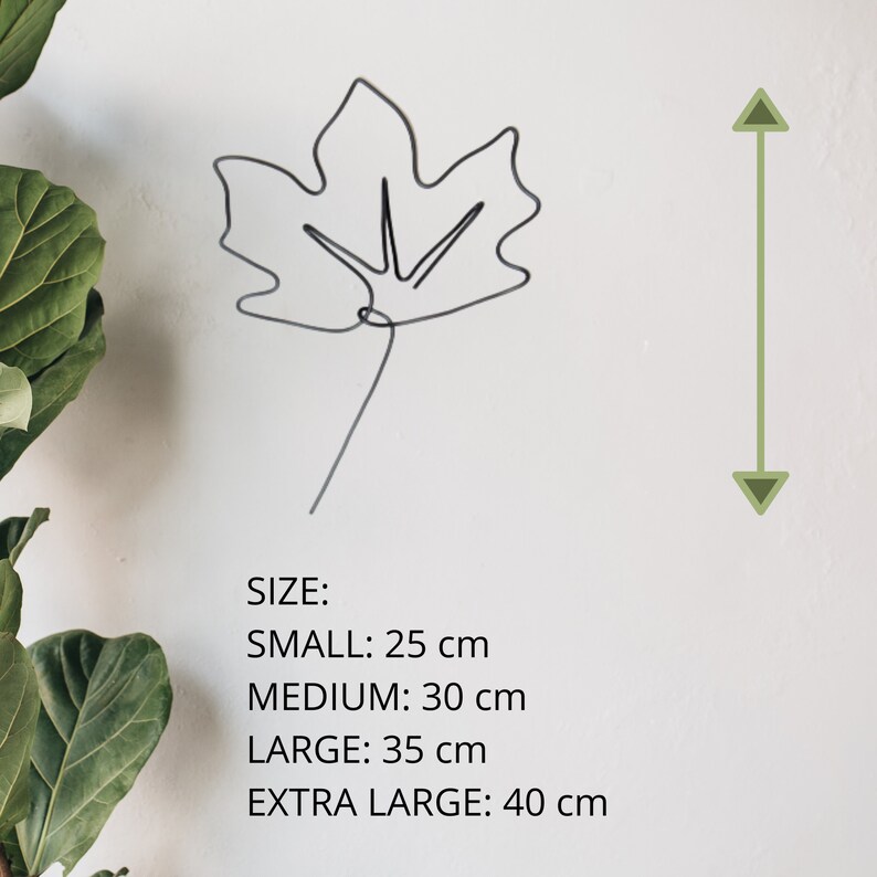 May include: A black wire leaf sculpture with a stem. The sculpture is available in four sizes: small (25 cm), medium (30 cm), large (35 cm), and extra large (40 cm).